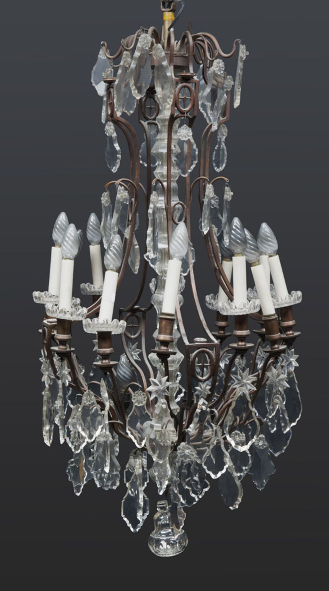 BRONZE CHANDELIER, EARLY 19TH CENTURY twelve molded arms, with glass pedestal base. Complete with