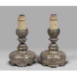 Pair of silver chandeliers, 18th century. Measures cm. 25 x 19. COPPIA DI CANDELIERI IN METALLO