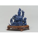 A CHINESE LAPISLAZULI GROUP, 20TH CENTURY depicting Guanyin. Measures cm. 13 x 13 x 6. GRUPPO IN