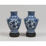 A PAIR OF WHITE AND BLUE PORCELAIN VASES, 20TH CENTURY