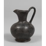 Etruscan Oinochoe in polished bucchus, 7th-6th century BC Measures cm. 18.5 x 13. OINOCHOE