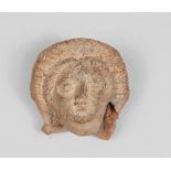 Votive head, Magna Greece 4th - 2nd century BC Measures cm. 6 x 6. TESTA VOTIVA, MAGNA GRECIA IV -