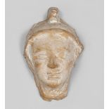 Votive head, Magna Greece 4th - 3th century BC Measures cm. 8 x 5.3. TESTA VOTIVA ELMATA, MAGNA