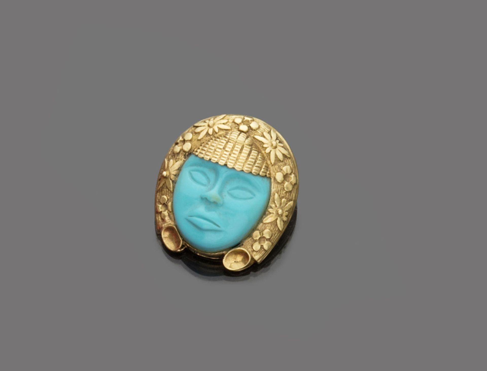 Yellow gold 18 kts. pendant, with turquoise stone Indian figure. Measures cm. 4 x 3,5, general