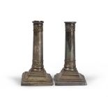 A PAIR OF SMALL SILVER CANDLESTICKS, EARLY 20TH CENTURY h. cm. 17, gross weight gr. 996. Lacks and