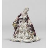 CERAMIC FIGURE OF WOMAN, 20TH CENTURY in polychrome, with a purple mantle. h. cm. 20. FIGURA DI