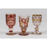 THREE GLASS GLASSES, BOEMIA AND FRANCE START XX CENTURY in ruby, ocher and transparent glass,