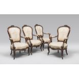 FOUR WOODEN ARMCHAIRS, 19TH CENTURY with medallion backs sculpted to the cimasa with flowers and