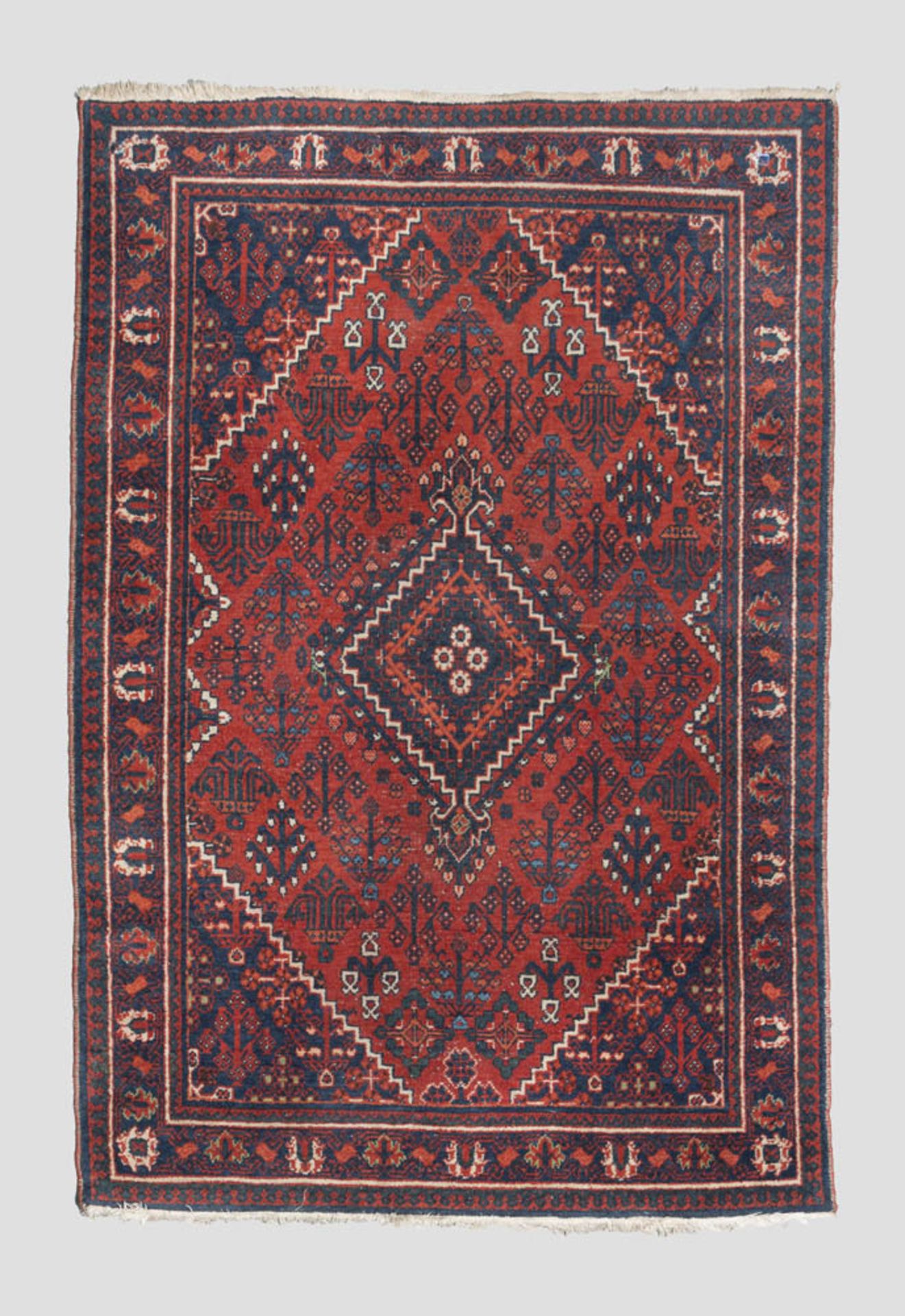 PERSIAN VISS CARPET, FIRST HALF 20TH CENTURY with rhomboid medallions and secondary motifs with