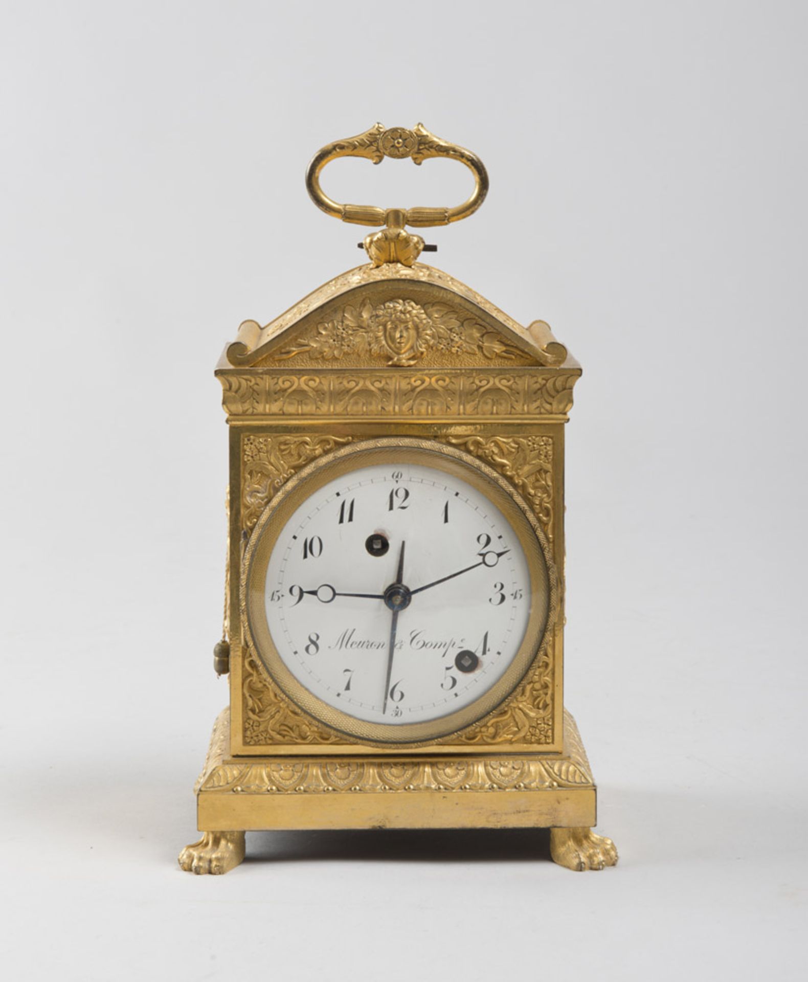 GILT BRONZE TABLE CLOCK, LATE 18TH CENTURY White enamel dial, marked 'Meuron & Comp'. 'Ainè