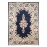 A WONDERFUL KIRMAN CARPET, FIRST HALF OF 20TH CENTURY With medallion on racemes of flowers and