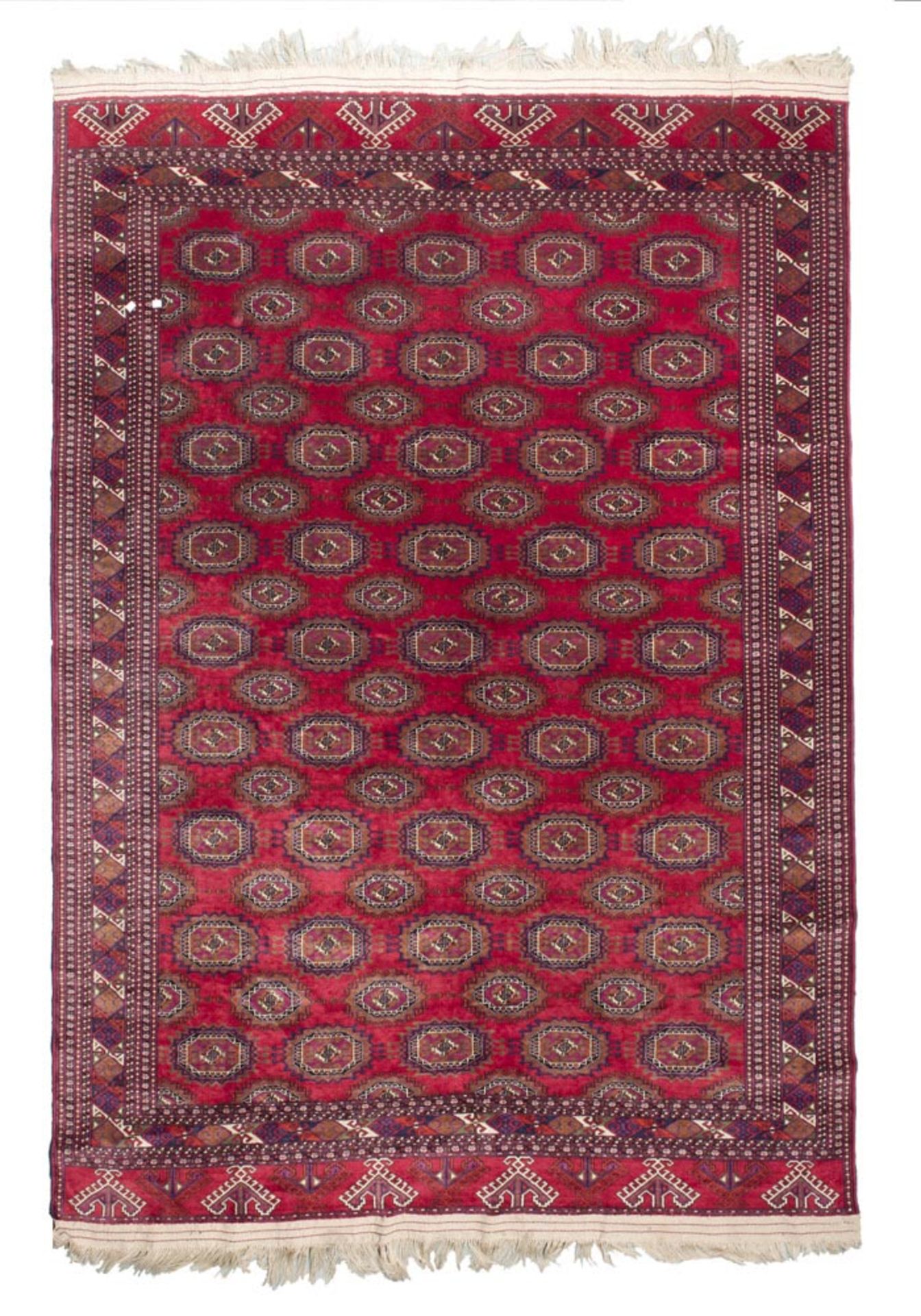 A BEAUTIFUL PAKISTAN CARPET, HALF 20TH CENTURY 'Tekke' design, with sequence of medallions, in the