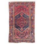 HAMADAN CARPET, MID 20TH CENTURY with jagged medallions and secondary motifs with branches of