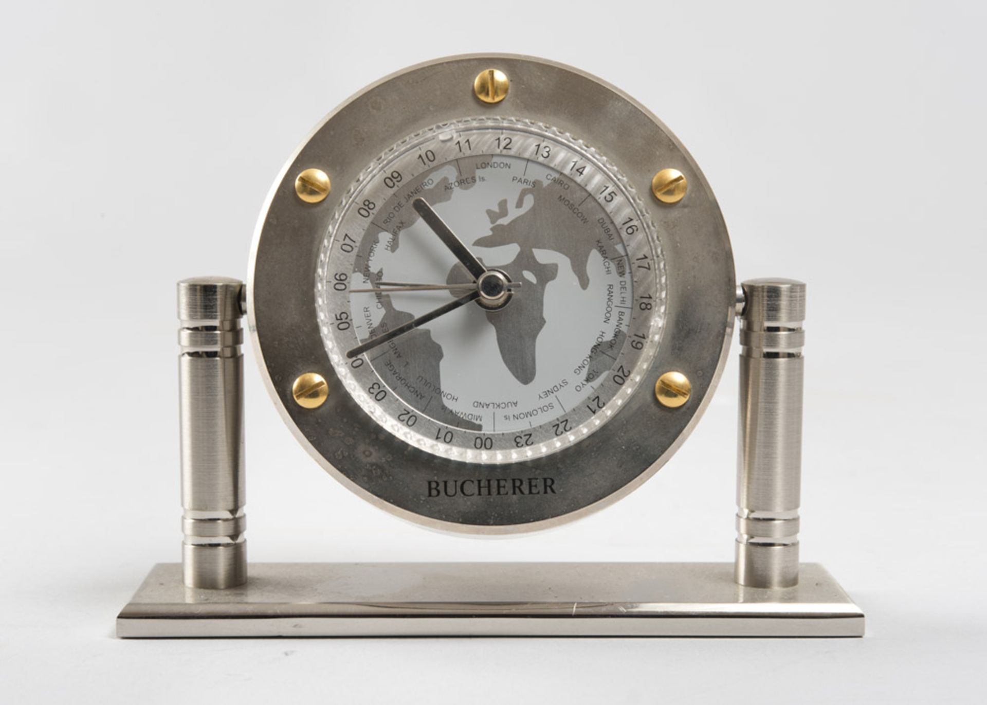 TABLE CLOCK, BRAND BUCHERER with circular brass case and dial with date and moon phase. Measures cm.