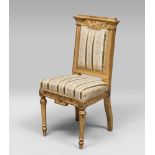 GILTWOOD CHAIR, 19TH CENTURY with architectural line back, sculptured to the cherub head, leaves and