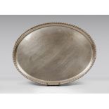 SILVER TRAY, 20TH CENTURY with rolled ribbon edge. Measures cm. 43 x 21, weight gr. 778. VASSOIO