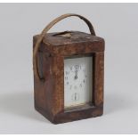 BRUSHED BRASS TABLE CLOCK, E. HAUSSMAN & CO, EARLY 20TH CENTURY with a glazed body. Dial signed.