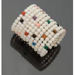 SEMIRIGID BRACELET eleven wires of white coral with alternating hard stones of various colors.