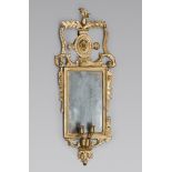 GILT WOOD WALL MIRROR, NORTH ITALY 18TH CENTURY Measures cm. 100 x 40 x 15. SPECCHIERA IN LEGNO