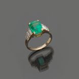 RING in 18 kt white gold, central emerald and diamonds lateral baguette cut. Emerald ct. 2.70