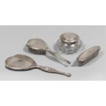 Silver toilet set composed of hand mirror, two brushes and box, early 20th century. Hand mirror