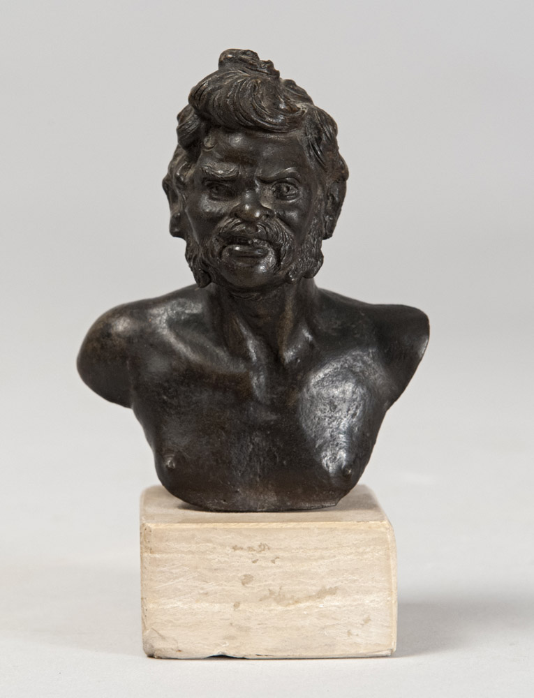 ITALIAN SCULPTOR, LATE 18TH CENTURY GROTTESQUE BRONZE BUST Travertine base. Measures cm. 10 x 8,5.