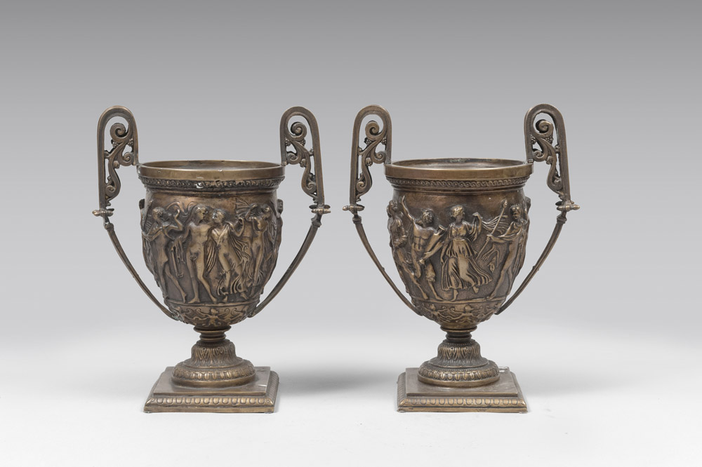 A PAIR OF BRONZE VASES, LATE 19TH CENTURY from a Roman model, with bas-reliefs. Measures cm. 30 x 23