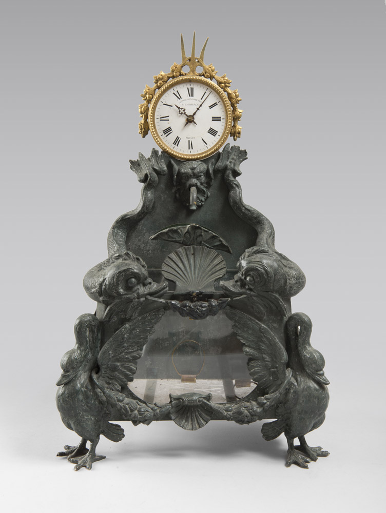 RARE WATCH-FOUNTAIN, 19TH CENTURY with a green patina bronze basin, dolphin-fountain carved. Feet to