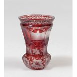 SMALL GLASS CUTTER, FRANCE IN THE MIDDLE EARLY CENTURY ruby bottom, engraved with city and flower