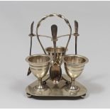 SILVER PLATED EGGS-HOLDER, ENGLAND MID 20TH Complete with teaspoons. Measures cm. 19 x 12 x 14.