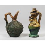 TWO EARTHENWARE PITCHERS, SOUTH ITALY LATE 19TH CENTURY green and yellow enamel. Animated figure