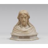 ALABASTER BUST, MID 20TH CENTURY depicting Christ's bust. Polygonal base titled to the front.