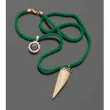 TWO PENDANTS of which one in bone and one in compass, arranged on a green silk cord with 18kt yellow