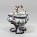 PORCELAIN VASE, SEVRES EARLY 20TH CENTURY in polychrome with vegetable decora tion. Three tanks,