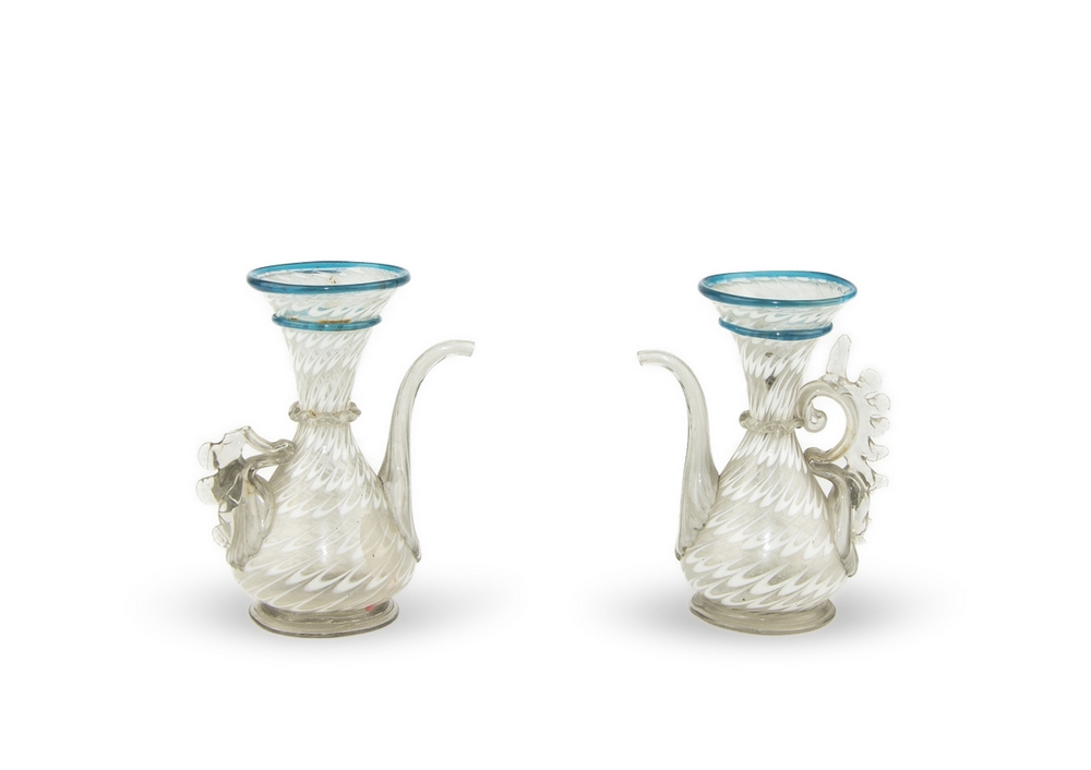 PAIR OF OIL-SET, VENICE LATE 19TH-CENTURY in transparent glass with milk glass. Two rings in glass