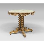 GILTWOOD TABLE, PROBABLY 19TH CENTURY with green lacquered octagonal top. Carved leaf and roccailles