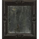 Small Ebony Mirror, Holland 18th century Carved with diamond tips with a quarter-turn. Measures