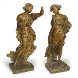 PAIR OF WOODEN SCULPTURES, NORTH ITALY LATE 17TH CENTURY depicting angels posing. Rectangular bases.