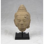 A Kmer carved sandstone Buddha's head. Cambodia, 12th - 13th century. h. cm. 23 x 15 x 13. TESTA