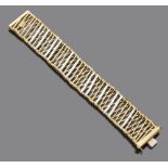 BRACELET in 18 kt yellow gold. mesh knit with interlaced elements in white gold. Signed 'Orlandini'.