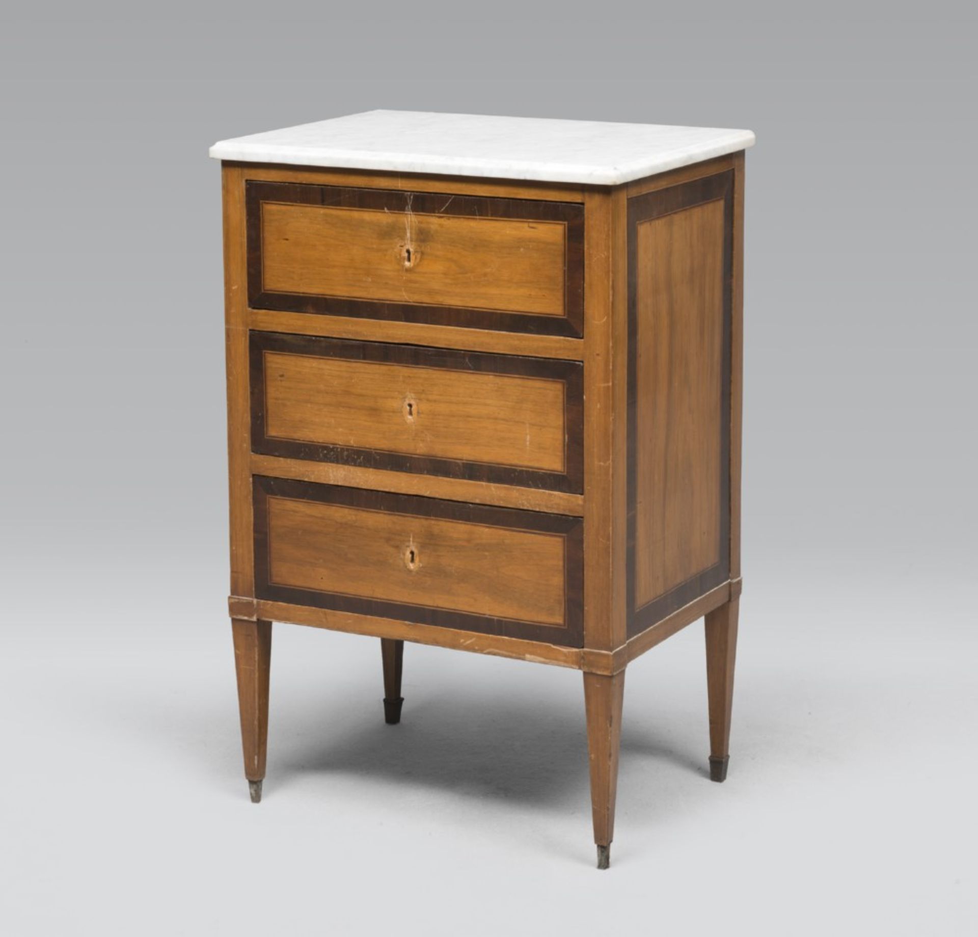 WALNUT BEDSIDE TABLE, PROBABLY LOMBARDY, EARLY 19TH CENTURY with purple ebony reserves. Three