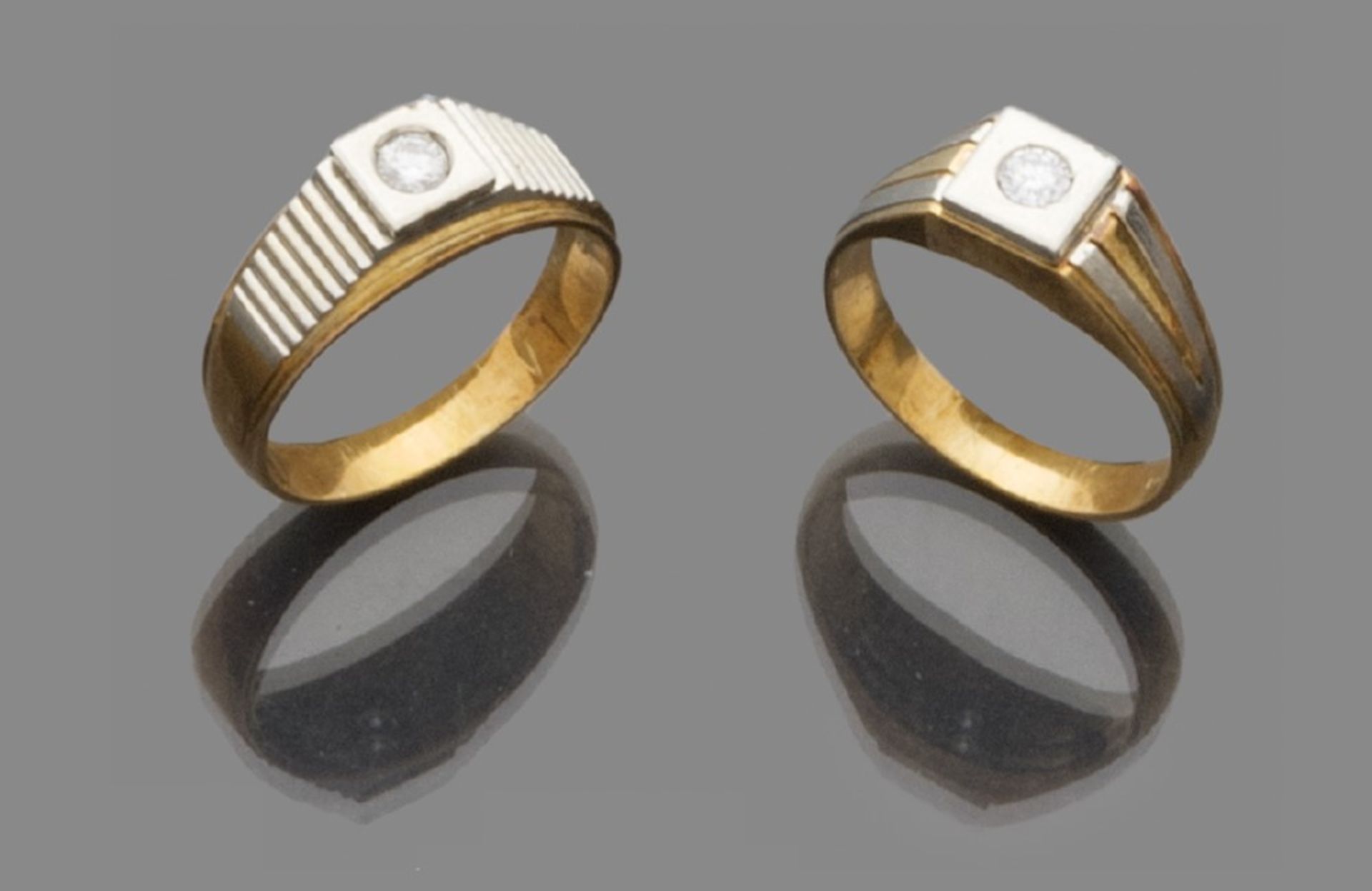 TWO RINGS FOR MEN in 18 kt yellow gold, set with central brilliants. Brilliant ct. About 0.40, total