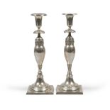 COUPLE OF CANDLESTICKS IN SILVER, PUNZON XIX CENTURY with bulb shaft and palmette finishes. Square