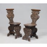 Pair of Walnut benches, elements of the 17th century Sculpted with noble coats of arms, winged