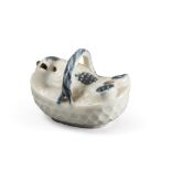 A Korean white and blue porcelain spout for calligraphy. Early 20th century.. Measures cm. 6 x 7,5 x