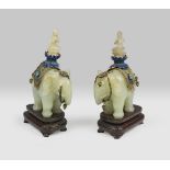 A pair of Chinese jade sculpture, depicting Puxian with cloisonnè vestments. 20th century.