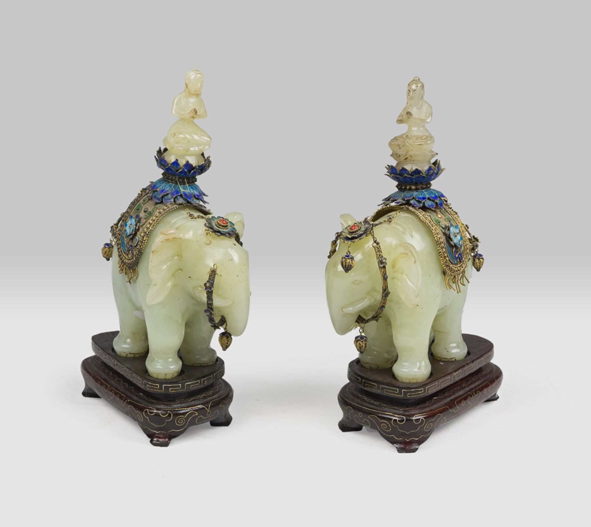 A pair of Chinese jade sculpture, depicting Puxian with cloisonnè vestments. 20th century.