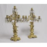 PAIR OF GILT BRONZE CHANDLESTICK, 19TH CENTURY with six arms in leafy tendrils and stem figure-