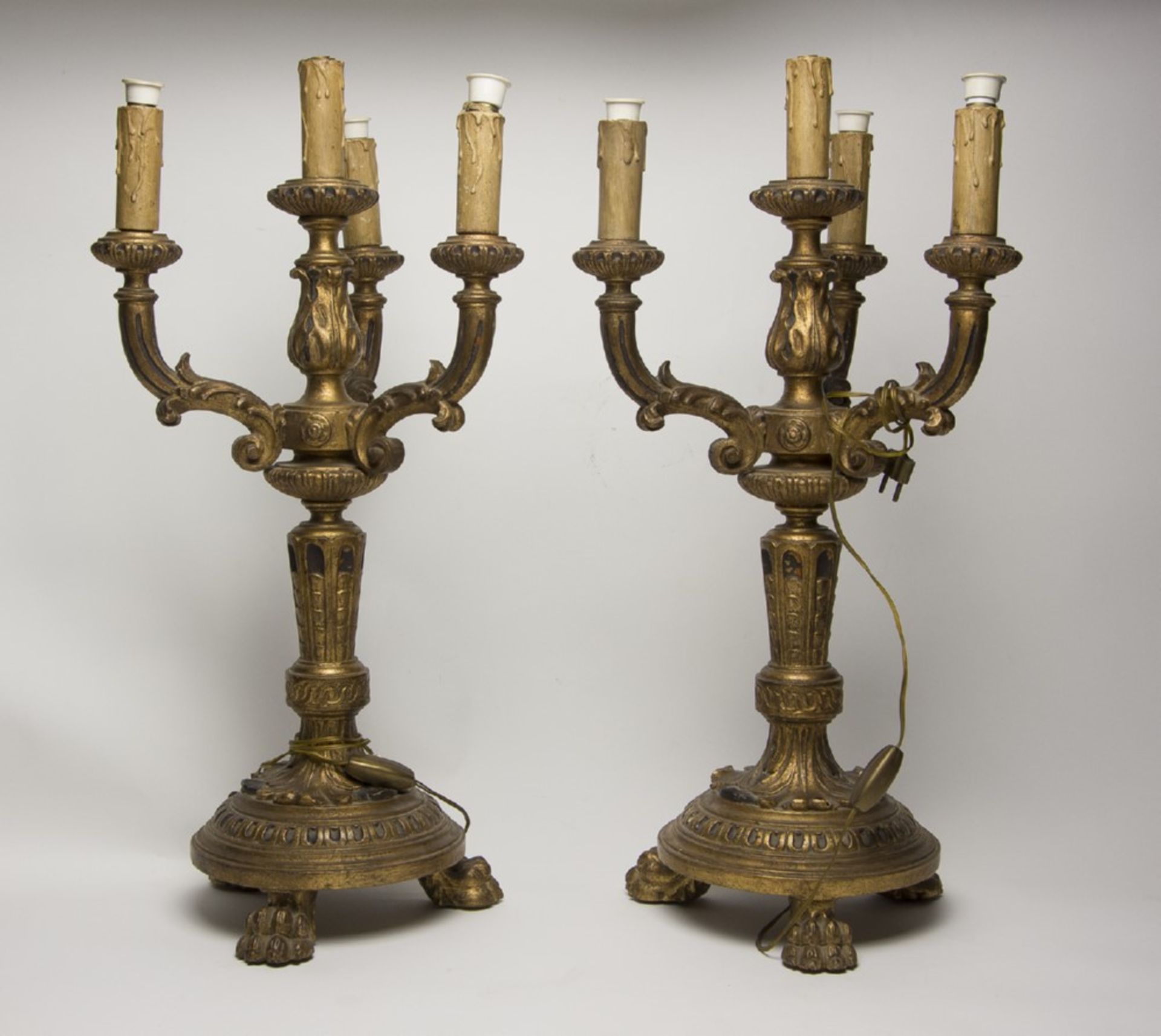 PAIR OF GILTWOOD CANDLESTICKS, LATE 19TH-CENTURY carved leaves, swirls and curls. Four arms.