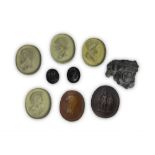 NINE GLASS AND SEMIPRECIOUS STONES MOLDS FOR CAMEO, 19TH CENTURY Classic heads and carved figures.